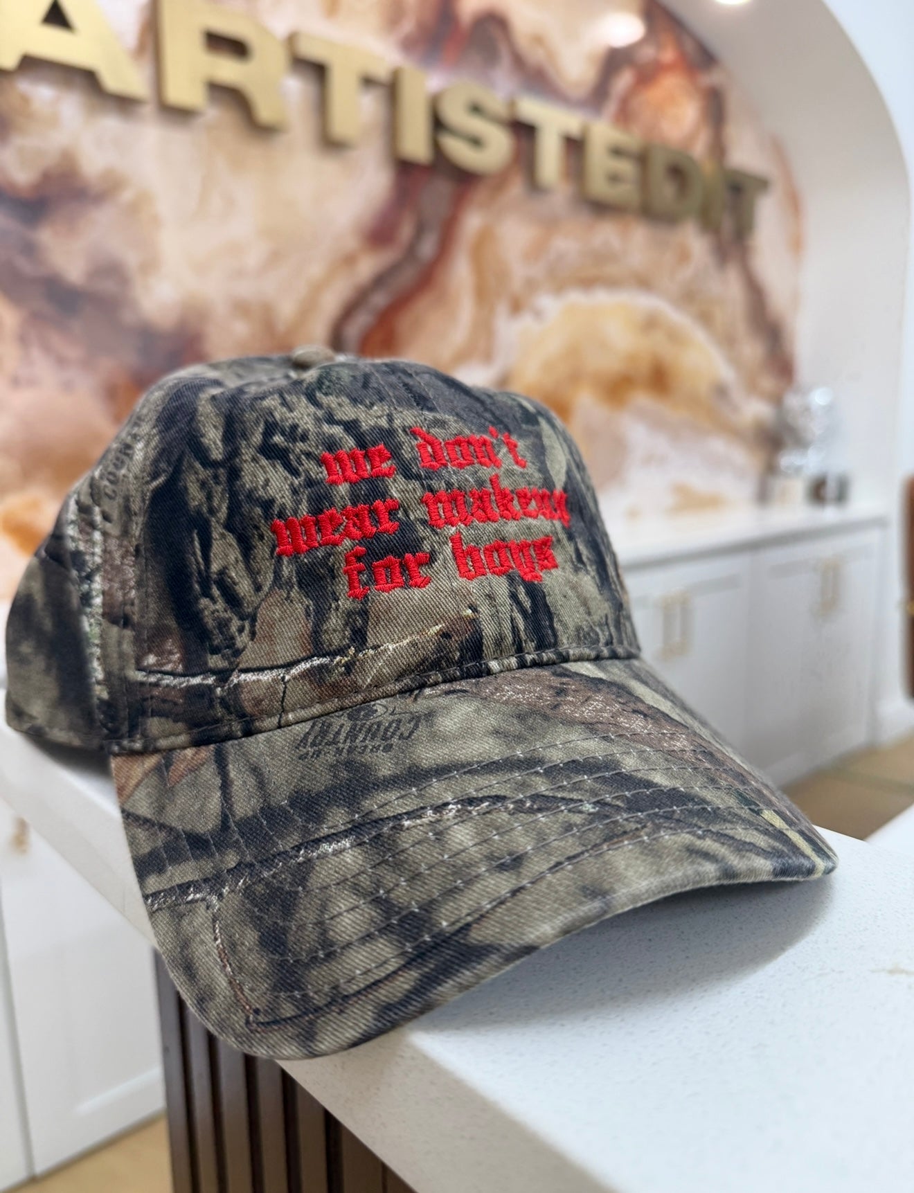 “we don’t wear makeup for boys” hat